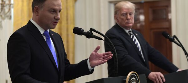 President Donald Trump, right, listens as Polish President Andrzej Duda, left, speaks during a joint news conference in the East Room of the White House in Washington, Tuesday, Sept. 18, 2018 President Donald Trump, right, listens as Polish President Andrzej Duda, left, speaks during a joint news conference in the East Room of the White House in Washington, Tuesday, Sept. 18, 2018 - Sputnik International