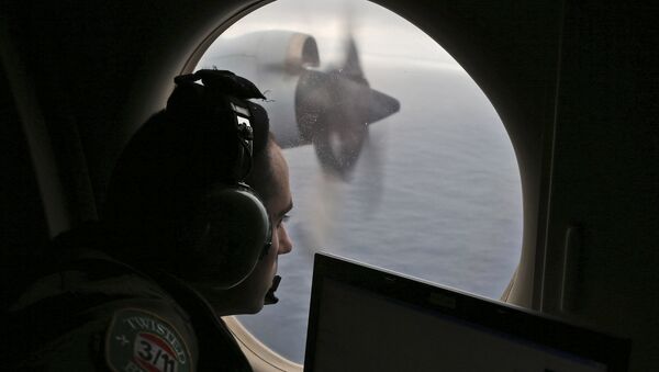 FILE - In this March 22, 2014 file photo, flight officer Rayan Gharazeddine on board a Royal Australian Air Force AP-3C Orion, searches for the missing Malaysia Airlines Flight MH370 in southern Indian Ocean, Australia - Sputnik International
