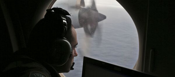 FILE - In this March 22, 2014 file photo, flight officer Rayan Gharazeddine on board a Royal Australian Air Force AP-3C Orion, searches for the missing Malaysia Airlines Flight MH370 in southern Indian Ocean, Australia - Sputnik International
