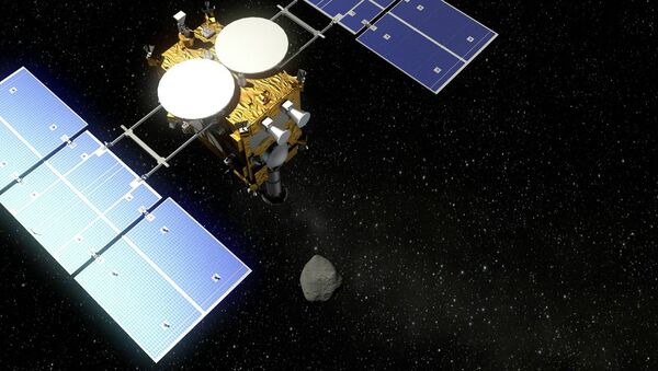 The Hayabusa 2 probe and an asteroid - visualization - Sputnik International