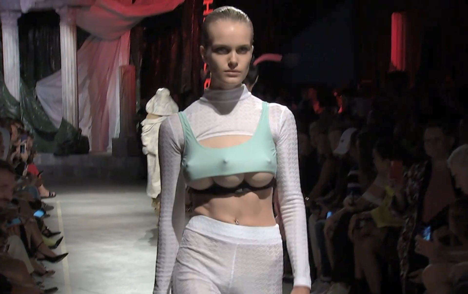 A catwalk at Milan Fashion Week has featured models with three breasts.