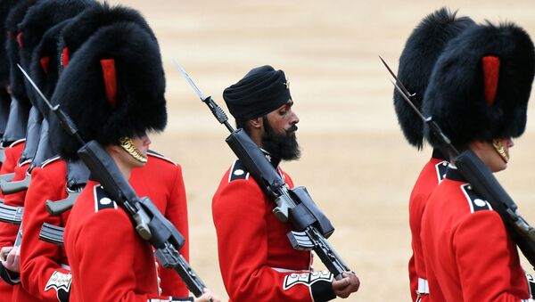 A Sikh member of the Coldstream Guards, center, wears a turban as he takes part in the Colonel's Review, the final rehearsal for Trooping the Colour, the Queen's annual birthday parade, in London, Saturday, June 2, 2018. - Sputnik International