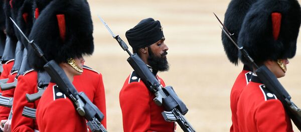 A Sikh member of the Coldstream Guards, center, wears a turban as he takes part in the Colonel's Review, the final rehearsal for Trooping the Colour, the Queen's annual birthday parade, in London, Saturday, June 2, 2018. - Sputnik International