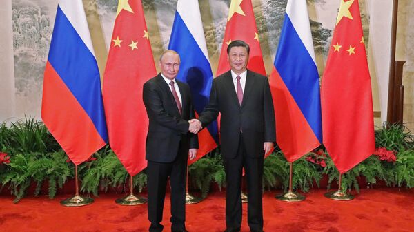 Russian President Vladimir Putin and Chinese President Xi Jinping during a meeting in Beijing (File) - Sputnik International