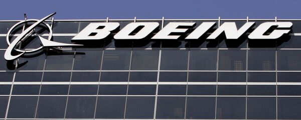 File-In this Wednesday, May 21,2008 file photo, the company logo for The Boeing Co., is displayed in El Segundo, Calif. Boeing Co. say it's cutting 1,100 jobs from its U.S. plants, most of them in Southern California, as it scales back production of its C-17 cargo planes. File-In this Wednesday, May 21,2008 file photo, the company logo for The Boeing Co., is displayed in El Segundo, Calif. Boeing Co. say it's cutting 1,100 jobs from its U.S. plants, most of them in Southern California, as it scales back production of its C-17 cargo planes. - Sputnik International