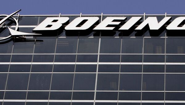 File-In this Wednesday, May 21,2008 file photo, the company logo for The Boeing Co., is displayed in El Segundo, Calif. Boeing Co. say it's cutting 1,100 jobs from its U.S. plants, most of them in Southern California, as it scales back production of its C-17 cargo planes. - Sputnik International