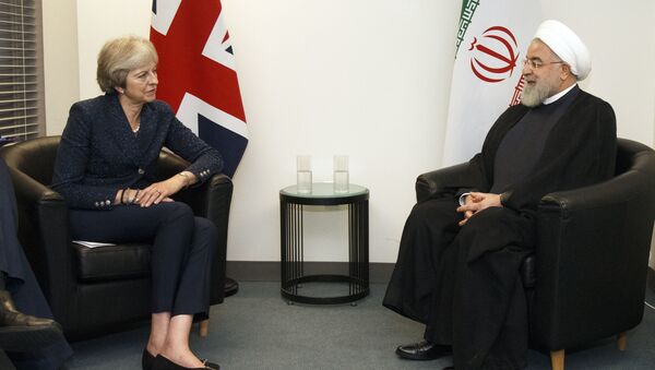 British Prime Minister Theresa May meets with Iranian President Hassan Rouhani on the sidelines of the 73rd session of the United Nations General Assembly at U.N. headquarters, Tuesday, Sept. 25, 2018. - Sputnik International