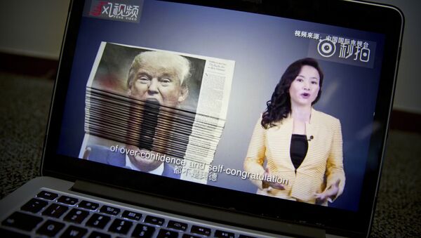 An online video about U.S.-China trade tensions produced by China's state television broadcaster plays on a computer screen in Beijing, China, Thursday, Aug. 23, 2018 - Sputnik International
