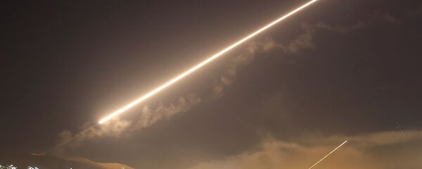 In this April 14, 2018 file photo, Damascus skies erupt with surface to air missile fire as the U.S. launches an attack on Syria targeting different parts of the Syrian capital Damascus, Syria In this April 14, 2018 file photo, Damascus skies erupt with surface to air missile fire as the U.S. launches an attack on Syria targeting different parts of the Syrian capital Damascus, Syria - Sputnik International