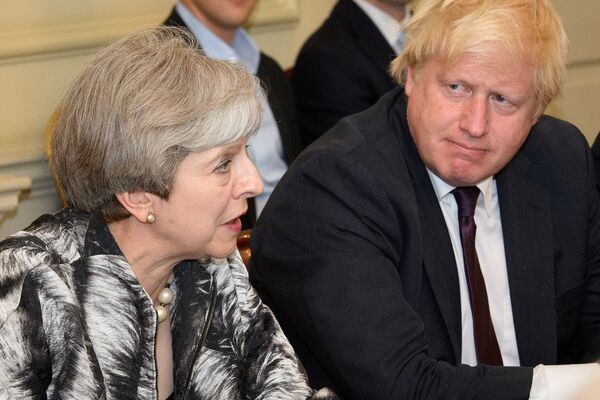 Britain's Prime Minister Theresa May sits next to Britain's Foreign Secretary Boris Johnson as she holds the first Cabinet meeting following the general election at 10 Downing Street, in London June 12, 2017 Britain's Prime Minister Theresa May sits next to Britain's Foreign Secretary Boris Johnson as she holds the first Cabinet meeting following the general election at 10 Downing Street, in London June 12, 2017 - Sputnik International