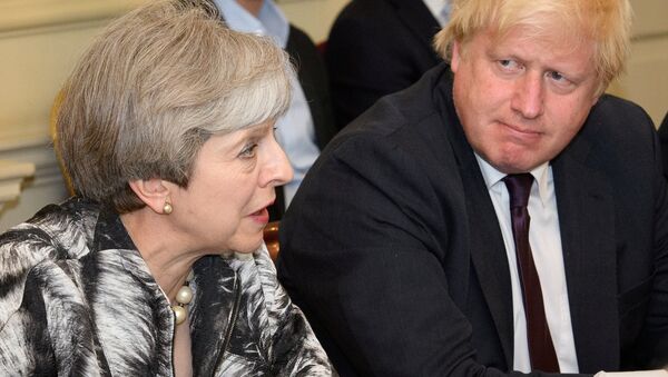 Britain's Prime Minister Theresa May sits next to Britain's Foreign Secretary Boris Johnson as she holds the first Cabinet meeting following the general election at 10 Downing Street, in London June 12, 2017 - Sputnik International