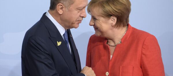 Turkish President Recep Tayyip Erdogan, left, is welcomed by German Chancellor Angela Merkel on the first day of the G-20 summit in Hamburg, northern Germany, Friday, July 7, 2017 - Sputnik International
