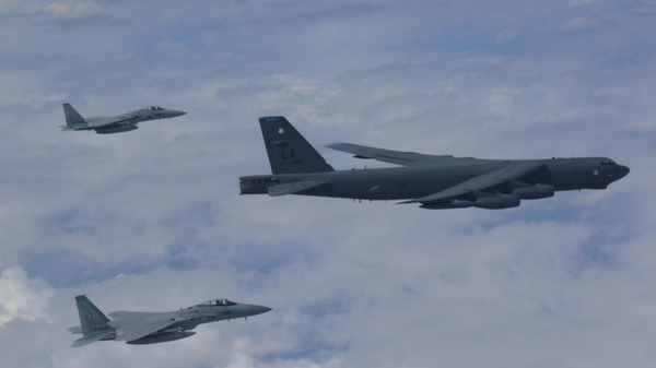 US B-52 bomber flies across East China Sea with two Koku Jieitai (Japan Air Self-Defense Force) F-15 fighters - Sputnik International
