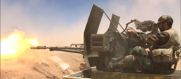 Syrian soldiers are shooting near the border with Iraq in Homs province Syrian soldiers are shooting near the border with Iraq in Homs province - Sputnik International