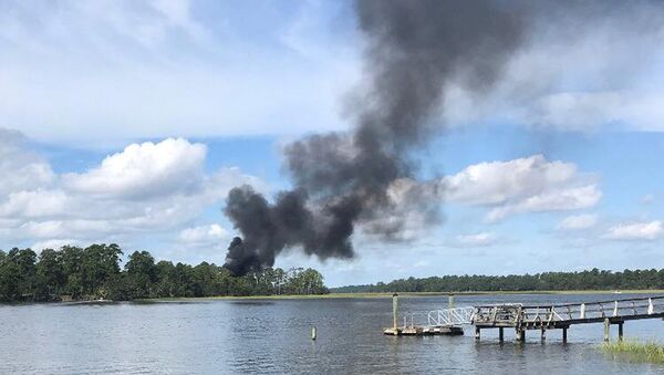 Smoke rises at the site of a F-35 jet crash in Beaufort, South Carolina, U.S., September 28, 2018 in this still image obtained from social media - Sputnik International