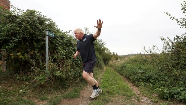 Britain's former Foreign Secretary Boris Johnson jogs near his home in Oxfordshire, September 11, 2018 - Sputnik International