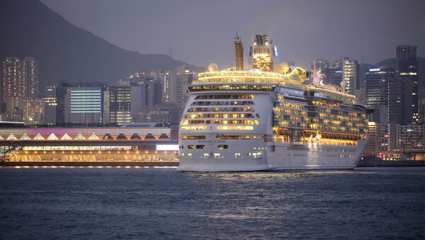 FILE - In this Wednesday, June 12, 2013, file photo, the Mariner of the Seas, right, one of the Voyager-class vessels of Royal Caribbean International, docks at Kai Tak Cruise Terminal in Hong Kong's Victoria Harbor. Royal Caribbean Cruises reports quarterly financial results before the market open on Monday, Jan. 27, 2014. - Sputnik International