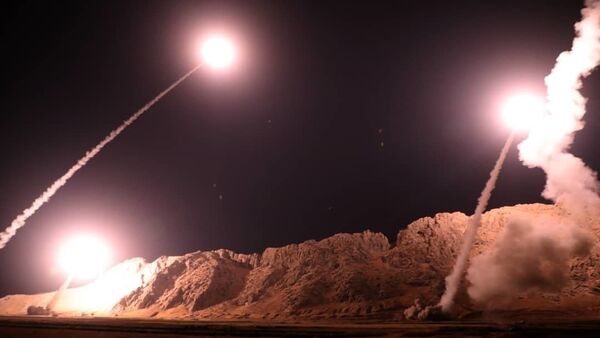 In this photo released on Monday, Oct. 1, 2018, by the Iranian Revolutionary Guard, missiles are fired from city of Kermanshah in western Iran targeting the Islamic State group in Syria. - Sputnik International