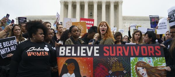 Protesters with Women's March and others gather in front of the Supreme Court on Capitol Hill in Washington, Monday, Sept. 24, 2018. A second allegation of sexual misconduct has emerged against Judge Brett Kavanaugh, a development that has further imperiled his nomination to the Supreme Court, forced the White House and Senate Republicans onto the defensive and fueled calls from Democrats to postpone further action on his confirmation. President Donald Trump is so far standing by his nominee. - Sputnik International