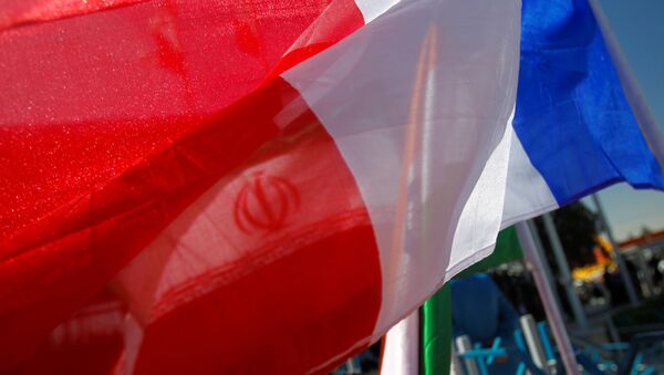France national flag flutters as an Iranian flag is seen behind (File) - Sputnik International