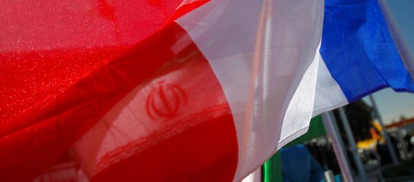 France national flag flutters as an Iranian flag is seen behind (File) - Sputnik International