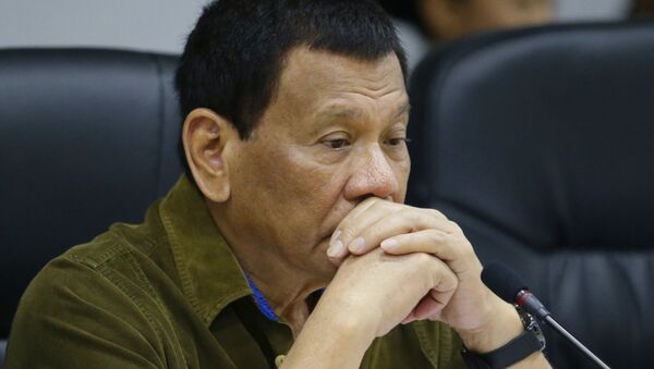 Philippine President Rodrigo Duterte attends a command conference at the National Disaster Risk Reduction and Management Council operations center in metropolitan Manila, Philippines. File photo - Sputnik International