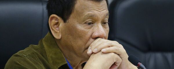 Philippine President Rodrigo Duterte attends a command conference at the National Disaster Risk Reduction and Management Council operations center in metropolitan Manila, Philippines. File photo Philippine President Rodrigo Duterte attends a command conference at the National Disaster Risk Reduction and Management Council operations center in metropolitan Manila, Philippines. File photo - Sputnik International