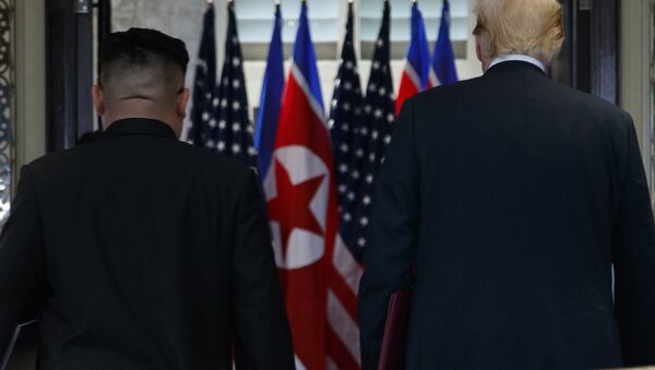 President Donald Trump and North Korean leader Kim Jong Un participate in a signing ceremony during a meeting on Sentosa Island, Tuesday, June 12, 2018, in Singapore - Sputnik International