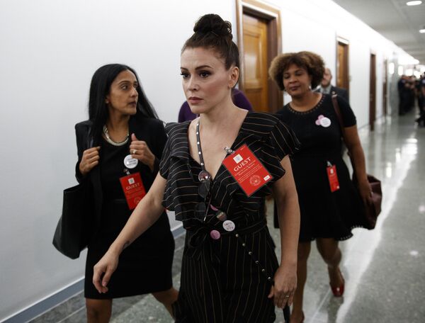 Actress Alyssa Milano walks to a Senate Judiciary Committee hearing after a break on Capitol Hill in Washington, Thursday, Sept. 27, 2018, with Christine Blasey Ford and Supreme Court nominee Brett Kavanaugh - Sputnik International