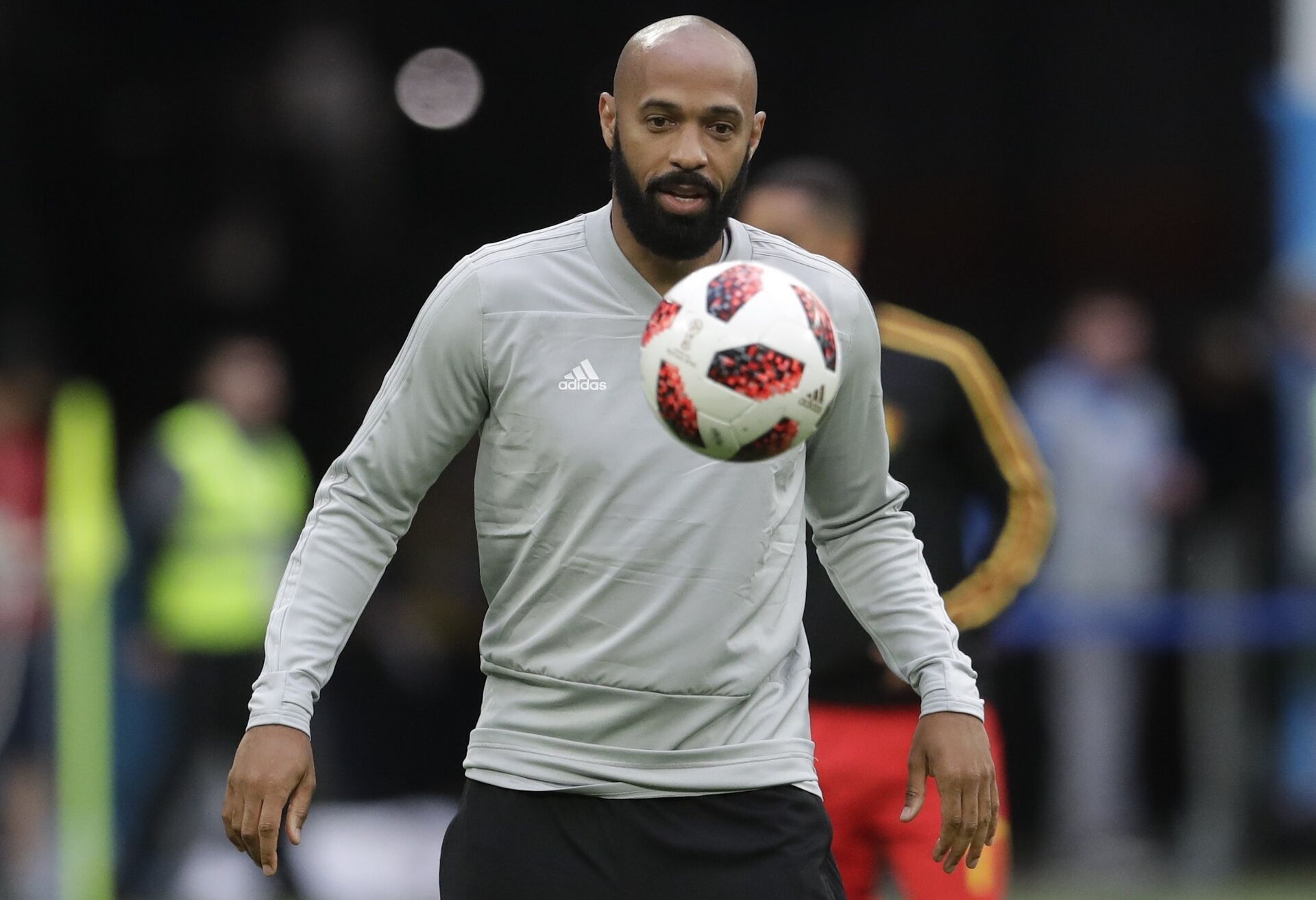 Belgium assistant coach Thierry Henry eyes the ball prior to the semifinal match between France and Belgium at the 2018 soccer World Cup in the St. Petersburg Stadium, in St. Petersburg, Russia, Tuesday, July 10, 2018 - Sputnik International, 1920, 26.10.2021