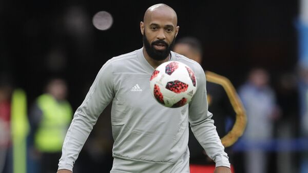 Belgium assistant coach Thierry Henry eyes the ball prior to the semifinal match between France and Belgium at the 2018 soccer World Cup in the St. Petersburg Stadium, in St. Petersburg, Russia, Tuesday, July 10, 2018 - Sputnik International