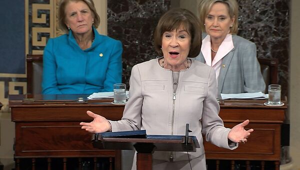 Sen. Susan Collins, R-Maine., speaks on the Senate floor about her vote on Supreme Court nominee Judge Brett Kananaugh, Friday, Oct. 5, 2018 in the Capitol in Washington. Sen Shelly Capito, R-W.Va., sits rear left and Sen. Cindy Hyde-Smith, R-Miss., sits right. (Senate TV via AP) - Sputnik International