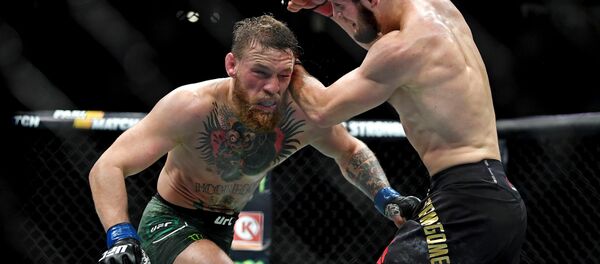 Khabib Nurmagomedov (red gloves) fights Conor McGregor (blue gloves) during UFC 229 at T-Mobile Arena in Las Vegas, Oct. 6, 2018 Khabib Nurmagomedov (red gloves) fights Conor McGregor (blue gloves) during UFC 229 at T-Mobile Arena in Las Vegas, Oct. 6, 2018 - Sputnik International