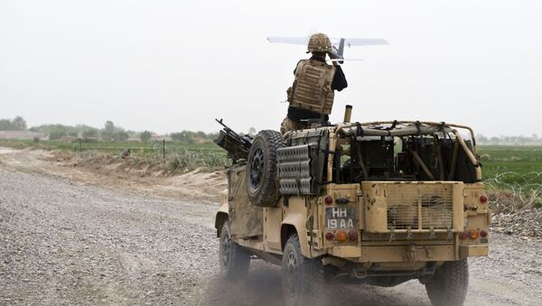 A soldier of Bravo Company, 1 Rifles launches a Desert Hawk UAV (Unmanned Aerial Vehicle) from a WMIK Landrover during an operation near Garmsir, Afghanistan. - Sputnik International