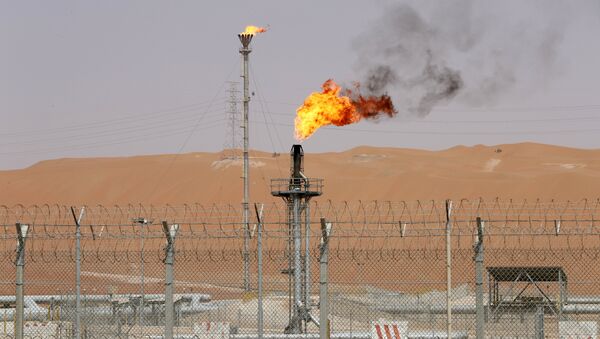 Flames are seen at the production facility of Saudi Aramco's Shaybah oilfield in the Empty Quarter, Saudi Arabia May 22, 2018. Picture taken May 22, 2018 - Sputnik International