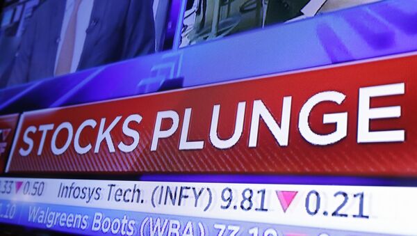 A headline scrolls on a television screen on the floor of the New York Stock Exchange, Wednesday, Oct. 10, 2018. Stocks are extending their slump on Wall Street, led by drops in big technology companies, as rising bond yields draw investors out of stocks.  - Sputnik International