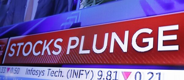 A headline scrolls on a television screen on the floor of the New York Stock Exchange, Wednesday, Oct. 10, 2018. Stocks are extending their slump on Wall Street, led by drops in big technology companies, as rising bond yields draw investors out of stocks. - Sputnik International