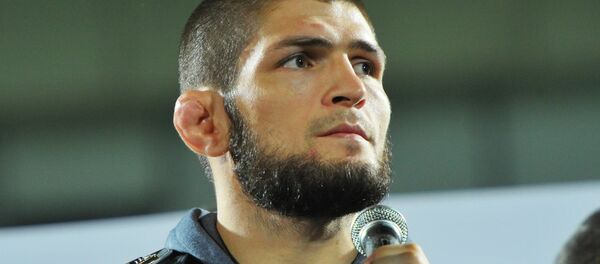 Khabib Nurmagomedov With UFC Champion Belt - Sputnik International