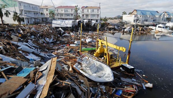A boat sits amidst debris in the aftermath of Hurricane Michael in Mexico Beach, Fla., Thursday, Oct. 11, 2018. - Sputnik International