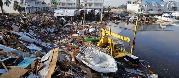 A boat sits amidst debris in the aftermath of Hurricane Michael in Mexico Beach, Fla., Thursday, Oct. 11, 2018. - Sputnik International