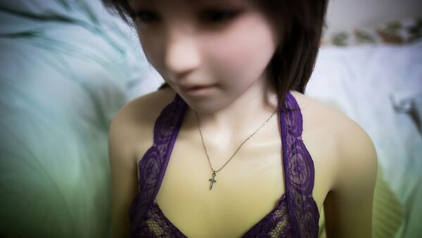 In this picture taken on April 20, 2017, a cross necklace is seen on Saori, a silicone sex doll owned by 62-year-old Senji Nakajima at his apartment on the outskirts of Tokyo. - Sputnik International
