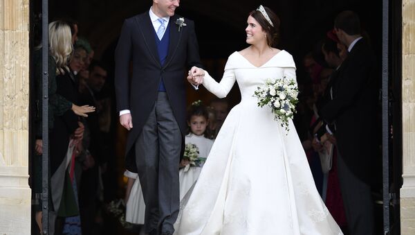 Britain's Princess Eugenie and Jack Brooksbank leave St George's Chapel after their wedding at Windsor Castle, near London, England, Friday Oct. 12, 2018. - Sputnik International