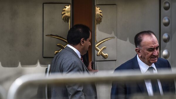 A Saudi official opens the door of the Saudi Arabian consulate in Istanbul on October 8, 2018 in Istanbul during a demonstration for missing journalist Jamal Khashoggi. - Sputnik International