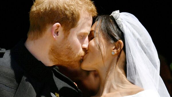 Prince Harry and Meghan Markle kiss on the steps of St George's Chapel in Windsor Castle after their wedding in Windsor, Britain, May 19, 2018 - Sputnik International