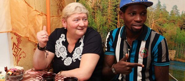 Prince Ajayi and his wife Natalia Vedenina. - Sputnik International