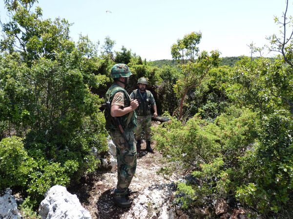 Syrian troops carrying out operations against militants in Latakia. Syrian troops carrying out operations against militants in Latakia. - Sputnik International
