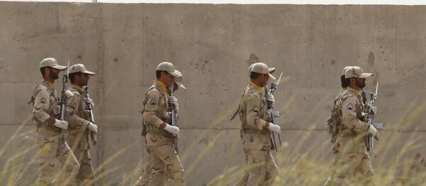 Iranian soldiers keep watch at a drug trafficking patrol post in Milak, southeastern Iran, near the Afghan border, on July 19, 2011 Iranian soldiers keep watch at a drug trafficking patrol post in Milak, southeastern Iran, near the Afghan border, on July 19, 2011 - Sputnik International