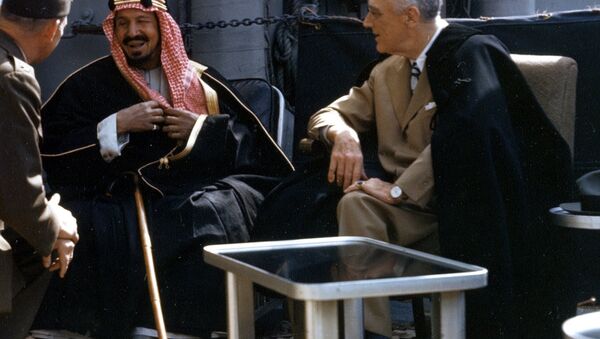 The U.S. President Franklin D. Roosevelt meets with King Ibn Saud of Saudi Arabia, on board the U.S. Navy heavy cruiser USS Quincy (CA-71) in the Great Bitter Lake, Egypt, on 14 February 1945. The King is speaking to the interpreter, Colonel William A. Eddy, USMC. - Sputnik International