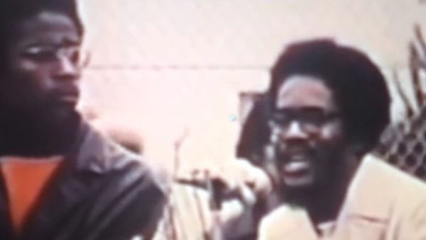 Walter Rodney, at right, speaks to a crowd in San Francisco, California, on African Liberation Day, May 25, 1972 - Sputnik International