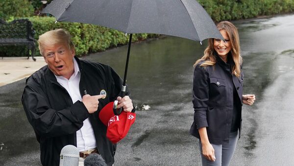 US President Donald Trump and First Lady Melania Trump make their way to board Marine One from the South Lawn of the White House in Washington, DC on October 15, 2018. - Trump is heading to Florida after Hurricane Michael devastated the state.  - Sputnik International